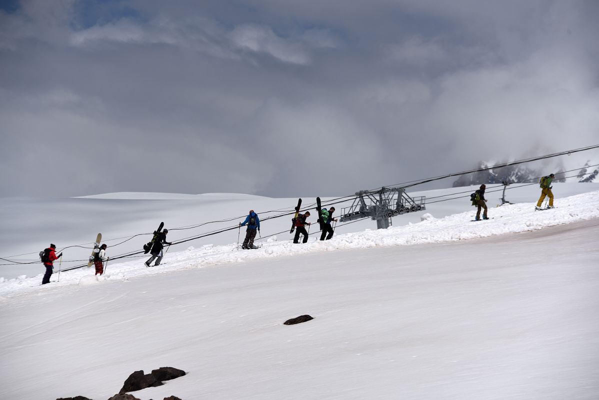 04E Snowboarders Walking Uphill View From The Chair Lift To Garabashi 3730m To Start The Mount Elbrus Climb